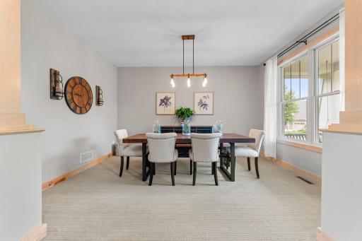 The large and bright dining room overlooks the front porch. 1137 Pioneer Trail, Bayport, MN