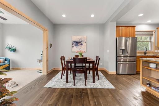 The kitchen opens to the sunroom on the left walks out to the deck. 1137 Pioneer Trail, Bayport, MN