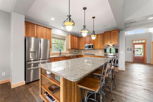 The large kitchen has a center island with another informal dining area, plenty of storage and is the heart of the home! 1137 Pioneer Trail, Bayport, MN