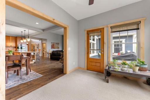 A view of the sunroom looking into the kitchen/living room as well as the door to the deck. 1137 Pioneer Trail, Bayport, MN