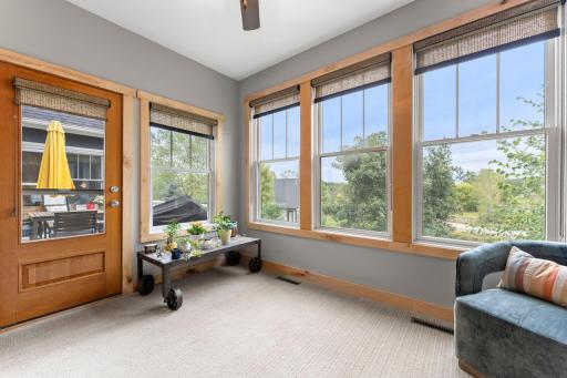 This sunroom could also be a reading nook, homework spot, open office-so many options! 1137 Pioneer Trail, Bayport, MN