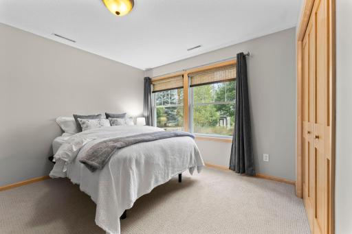 The 1st of two lower level bedrooms overlooking nature. 1137 Pioneer Trail, Bayport, MN