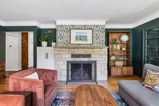 The beautiful living room limestone fireplace has been maintained regularly and is ready for your cozy fall and winter evenings
