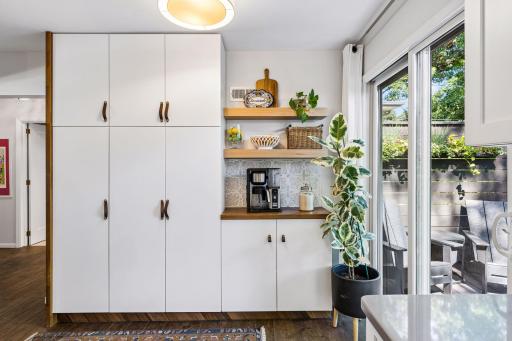 Pantry Storage and coffee bar are a perfect addition to the kitchen. The sliding door allows for easy access to your deck and patio