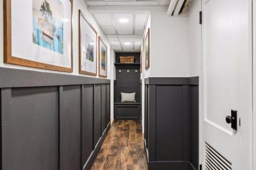 Walk down the hallway to enter the attached garage