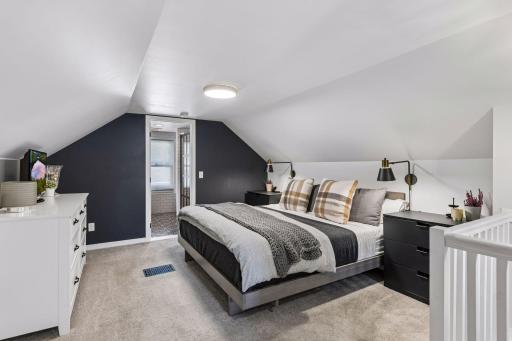The upstairs primary suite with an ensuite bathroom