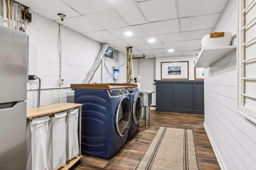 The lower level laundry with a 3 year old laundry pair