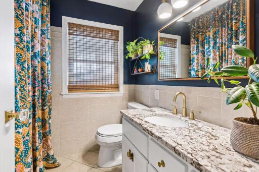 The main floor bathroom with granite countertops