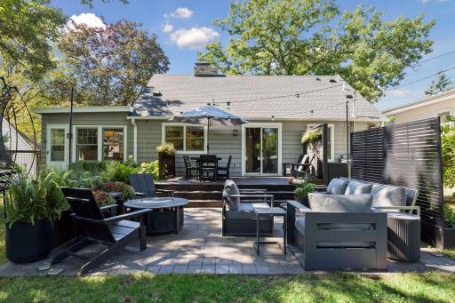 This is an amazing and private outdoor entertaining space with a tile patio and spacious deck