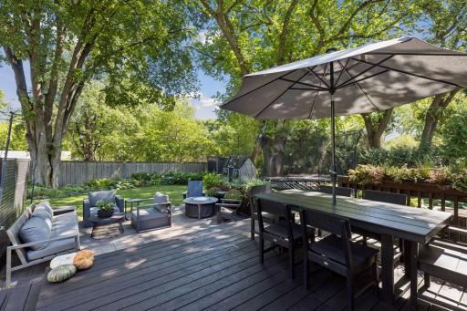 There is room for all of your backyard entertaining; a large table, a firepit and a grill are all you need!