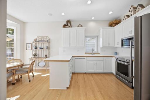 Kitchen with 10 foot ceilings; updated stainless kitchen appliances, and boxed out window over the sink.