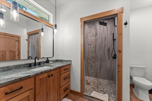 Stunning walk-in tile shower featured in the primary ensuite.