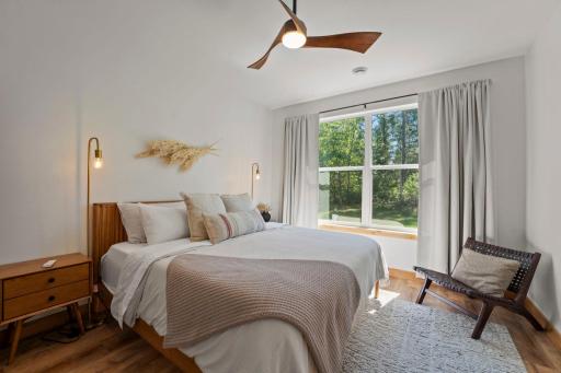 Primary suite overlooking the backyard with beautiful natural light.