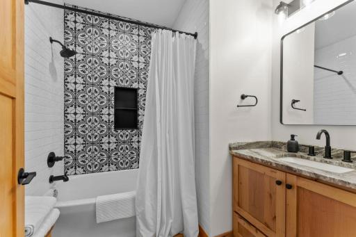 Full bathroom conveniently located between the two bedrooms and the main living area.