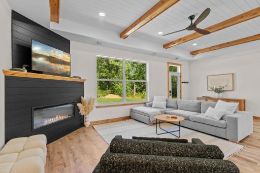 The living room offers a great-sized layout centered around an electric fireplace, giving you a comfortable spot to unwind after a day on the lake or to host friends and family.