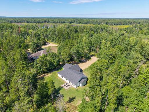 Wooded throughout and surrounding the property, offering natural privacy and a peaceful setting.