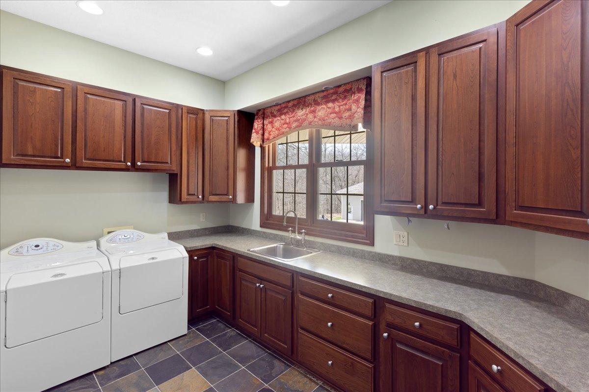The Laundry Room You Did Not Know You Needed. Warm Floors, Custom Storage, Zero Compromise