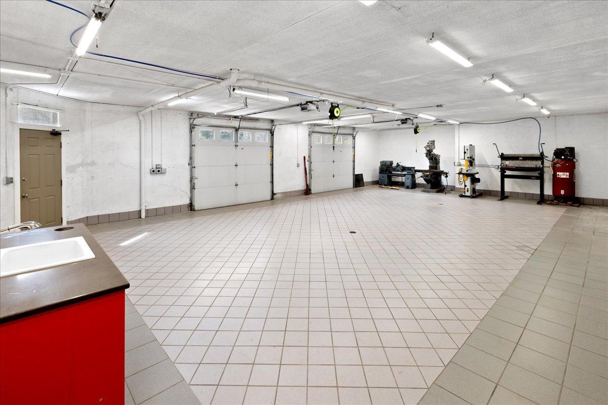 Lower Level Garage attached and heated - Not Just a Garage… A Space That Changes How You Use Your Home