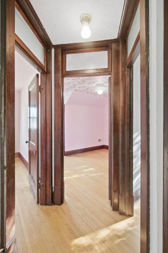 Bright transom windows highlight the upstairs bedrooms.