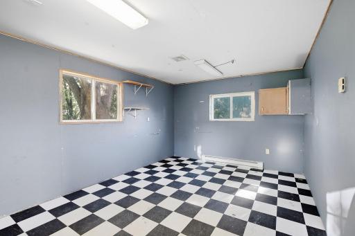 This room has so many possibilities - entertainment, exercise, hobbies & more!