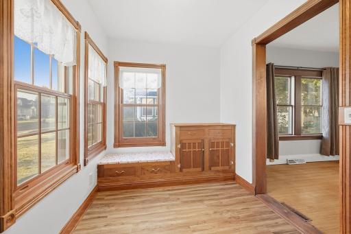This wonderful study off the living room has beautiful a beautiful built-in cabinet and bench to snuggle and read your favorite book.