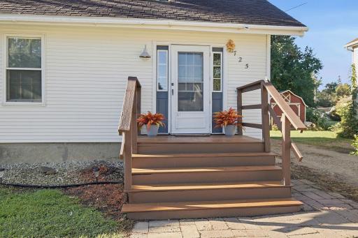 This welcoming front deck gives you a sampling of the beauty inside.