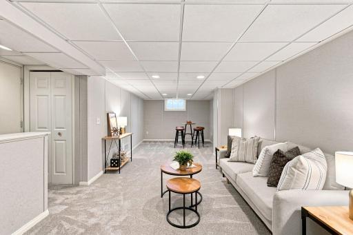 Spacious lower level family room with new carpet