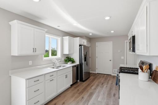 Plenty of workspace, storage, and an open layout make everything from morning coffee to weeknight dinners feel effortless. *photos of previously staged home, same floor plan and finishes however some features are not exact*