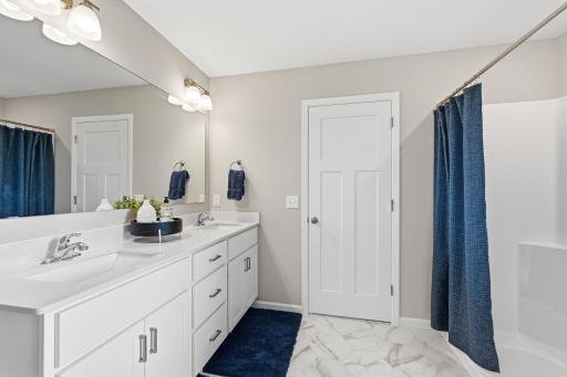 A thoughtfully designed primary bath gives you a dedicated space to get ready, reset, and unwind. *photos of previously staged home, same floor plan and finishes however some features are not exact*