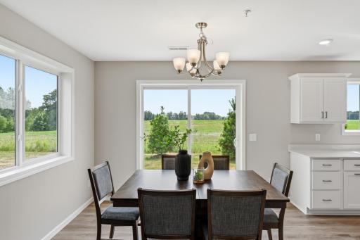 A dedicated dining space gives you room for everyday meals, dinner with friends, or Sunday morning pancakes. *photos of previously staged home, same floor plan and finishes however some features are not exact*