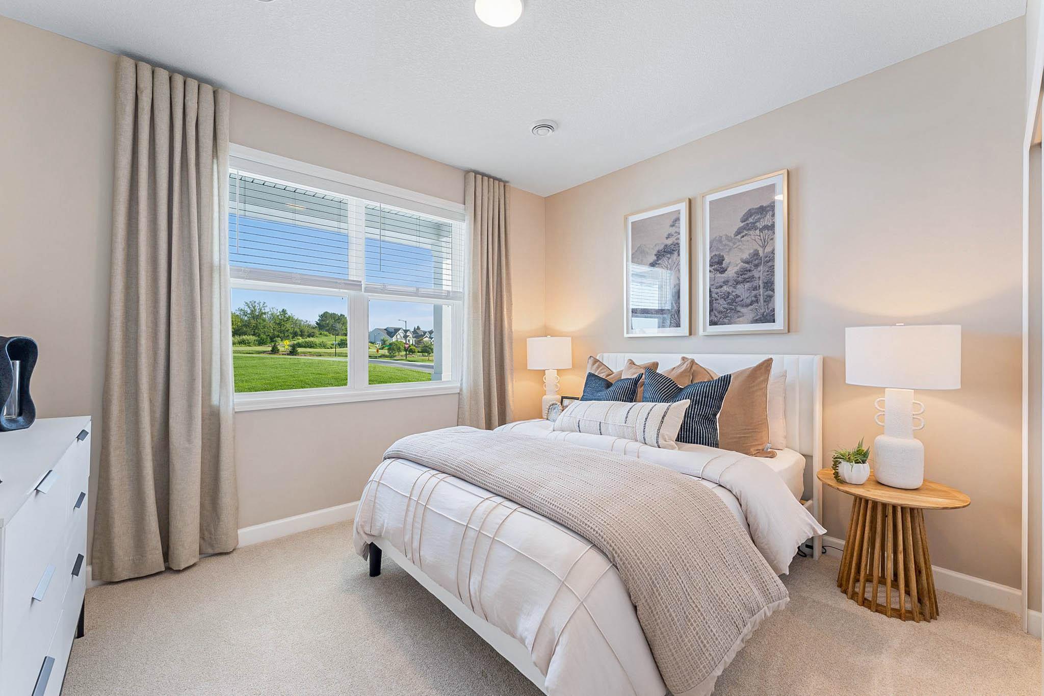 Two secondary bedrooms provide personal space and privacy away from the bustling main living areas, as well as a location adjacent to the full-sized bathroom for optimal convenience.