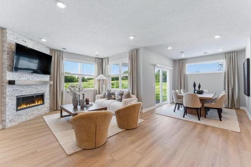 The Great Room is the heart of this home, where the family gathers to watch movies, enjoy leisurely weekend activities and laugh loudly together. An optional fireplace can be added to warm up the space.
