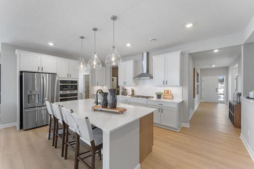 The large rectangular center island overlooks the Great Room and dining room in an excellent set-up for entertaining