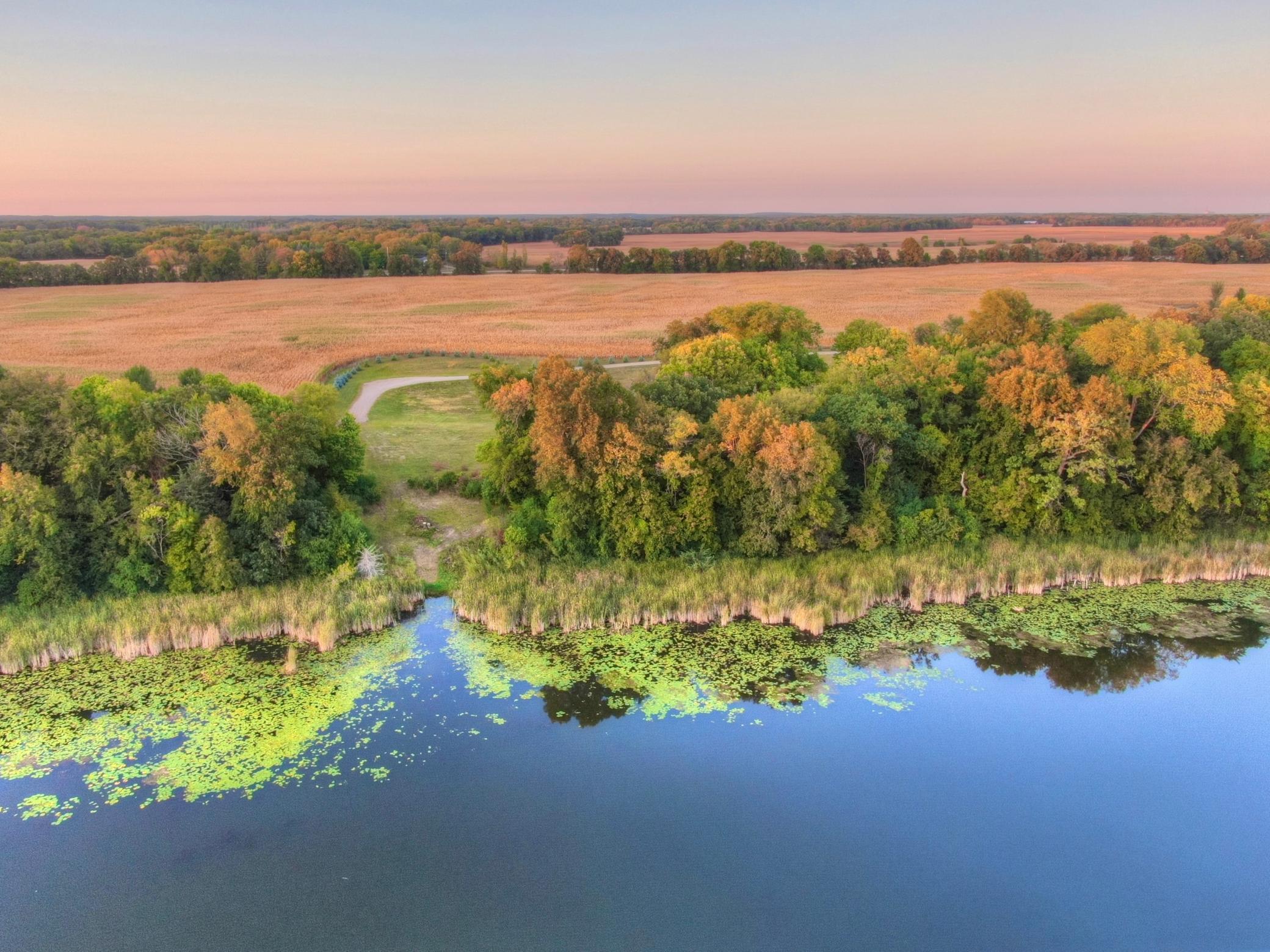 This expansive lot offers 340 feet of shoreline and a great amount of privacy being the furthest West property off of 80th Street. Imagine starting your day looking out over the tranquil waters of Lake John with clarity frequently around 10-12ft+.
