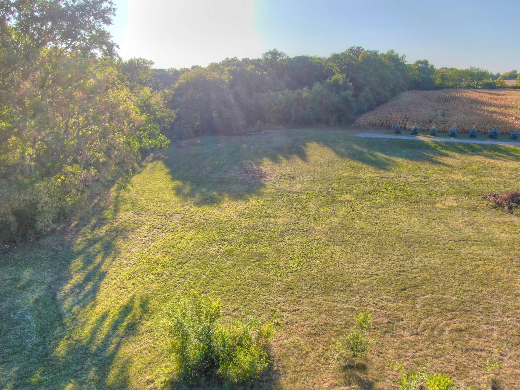 From the East to West the lot slopes downward towards the lake with about twelve feet of slow sloping elevation from the flat area down to the water. Would be easy to have a golf cart path to access your future dock/boat.