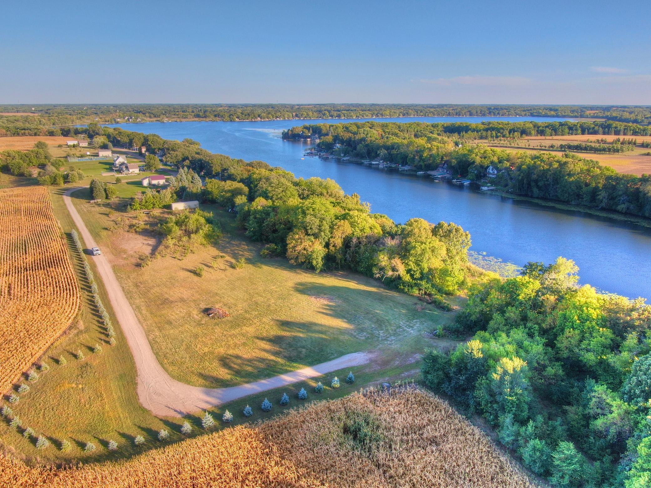 Welcome to Lake John where you will find this private 4 acre lot with 340 feet of south facing shoreline. The private driveway is located off a dead-end asphalt road that is well maintained. Hard to find lake lot with no HOA and Open to any builder.