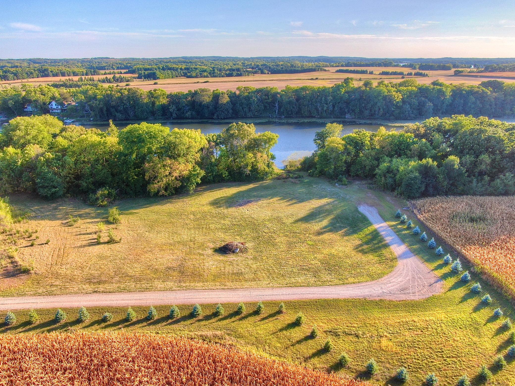 The Southern exposure allows for all day sun lakeside. The blue spruce trees that have been planted along the driveway will be straightened out to remove the turn around area that crosses the property line.