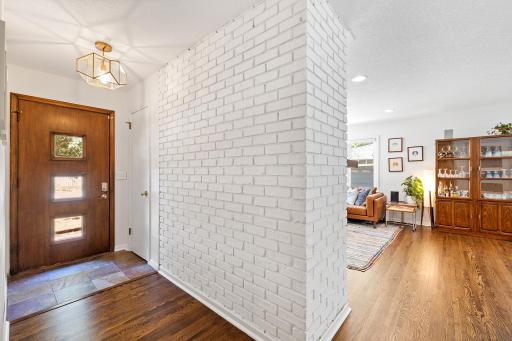 Main Entry with Hardwood Floors and Updated Lighting