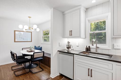Kitchen and Informal Dining Area Overlook Backyard