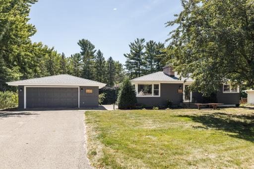 Walkway Between Home and Garage Leads to Backyard Retreat