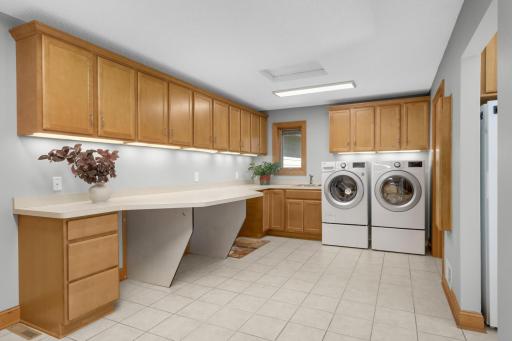 Functional everyday living with a massive laundry/mudroom that has access to the backyard. Perfect for kids & pets!