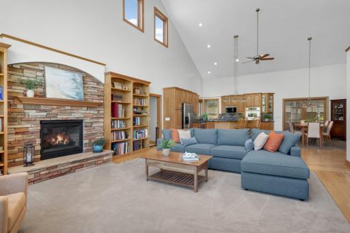 The focal point of the living room; a stone fireplace flanked by bookshelves