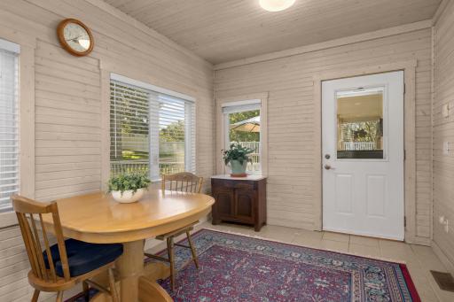 4-season porch leads to the secluded deck overlooking the backyard