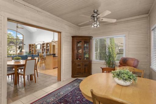Four season porch off the dining area is separated by French pocket doors