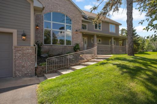 An impressive custom home with wraparound porch.