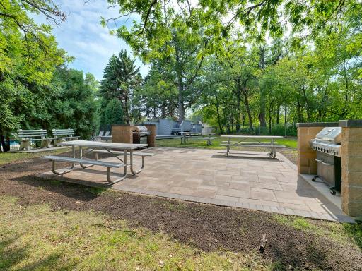 There is a picnic area next to the pool with tables and grills to enjoy.