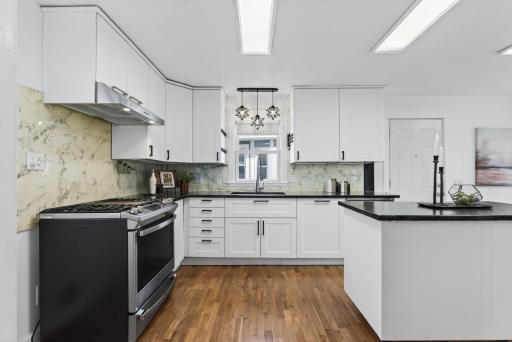The kitchen is modern with high quality appliances