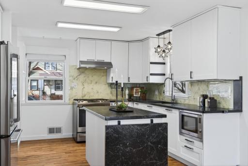 The kitchen is modern with high quality appliances