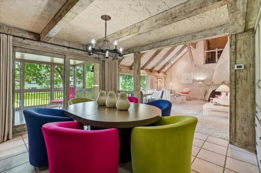 Dining room opens to living room and screened porch