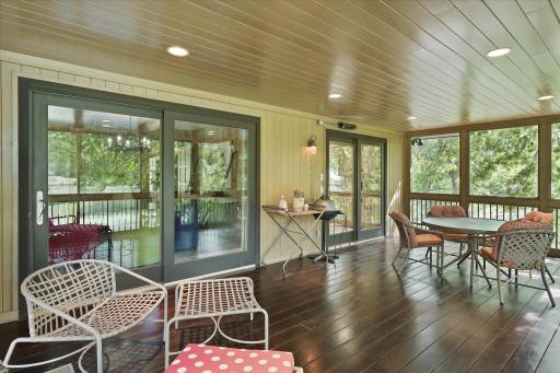 Screend porch connected to kitchen and dining room.